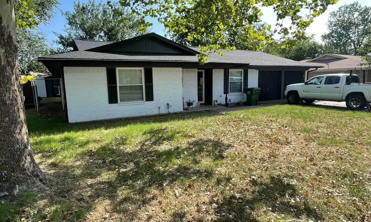 Professional roofing crew working on a residential roof in Titusville
